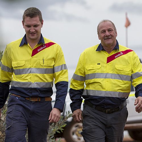 Two men in Sodexo uniforms walking together